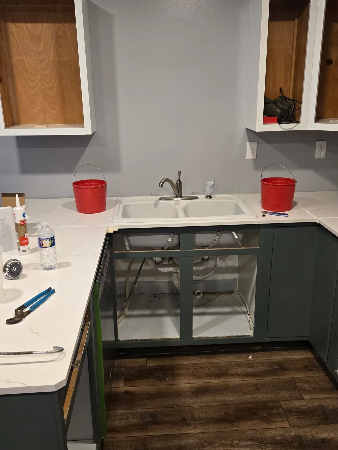 Kitchen sink plumbing during renovation